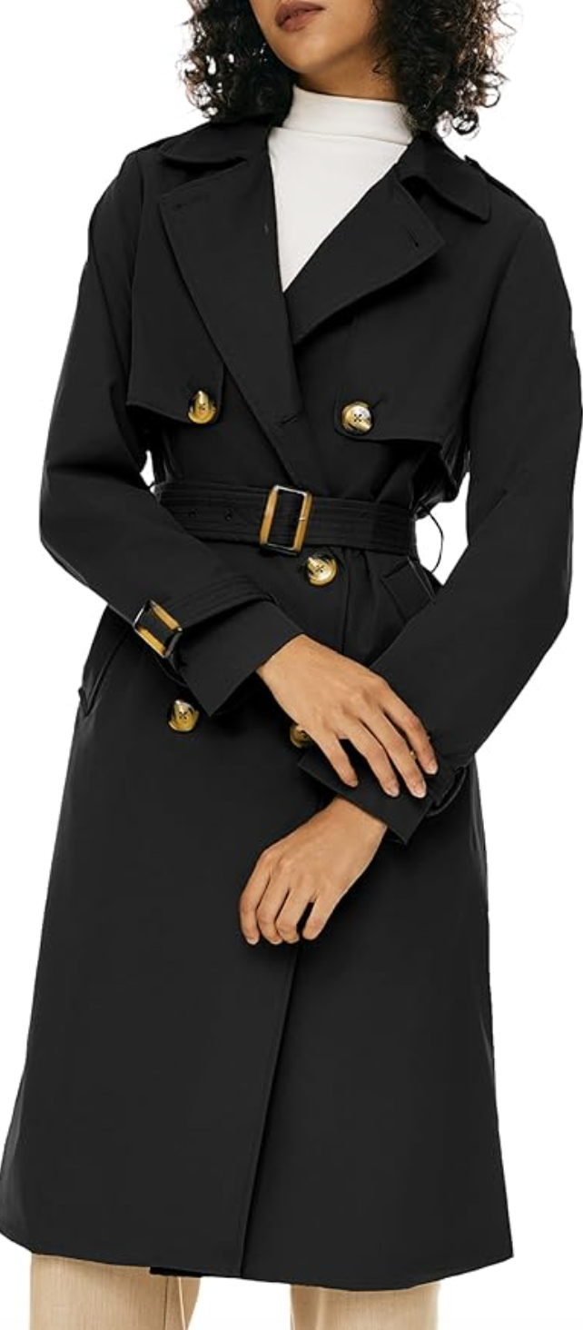 A close-up of a classic black double-breasted trench coat with gold buttons and a belted waist, styled over a white turtleneck for a polished spring outfit for women in their 60s.