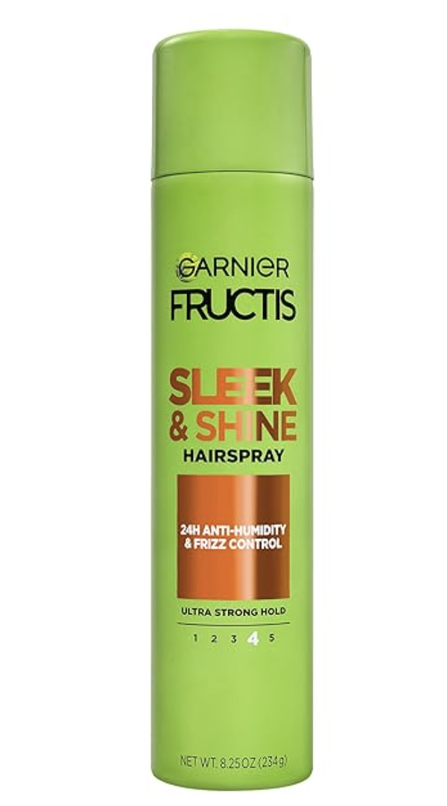 A bright green aerosol can of Garnier Fructis Sleek and Shine Hairspray featuring 24H anti-humidity and frizz control, shown against a clean background.