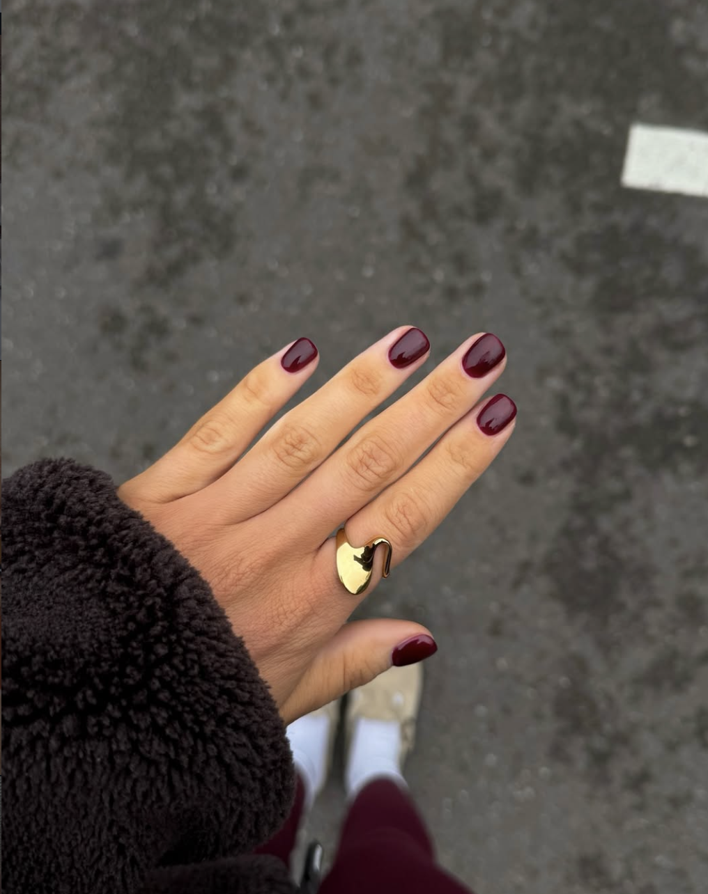Short glossy nails in deep smoky red for Fall 2026
