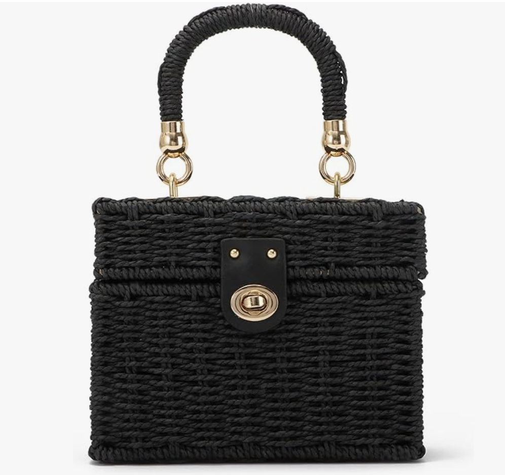 A structured black wicker rattan box bag with a natural bamboo top handle and gold hardware.