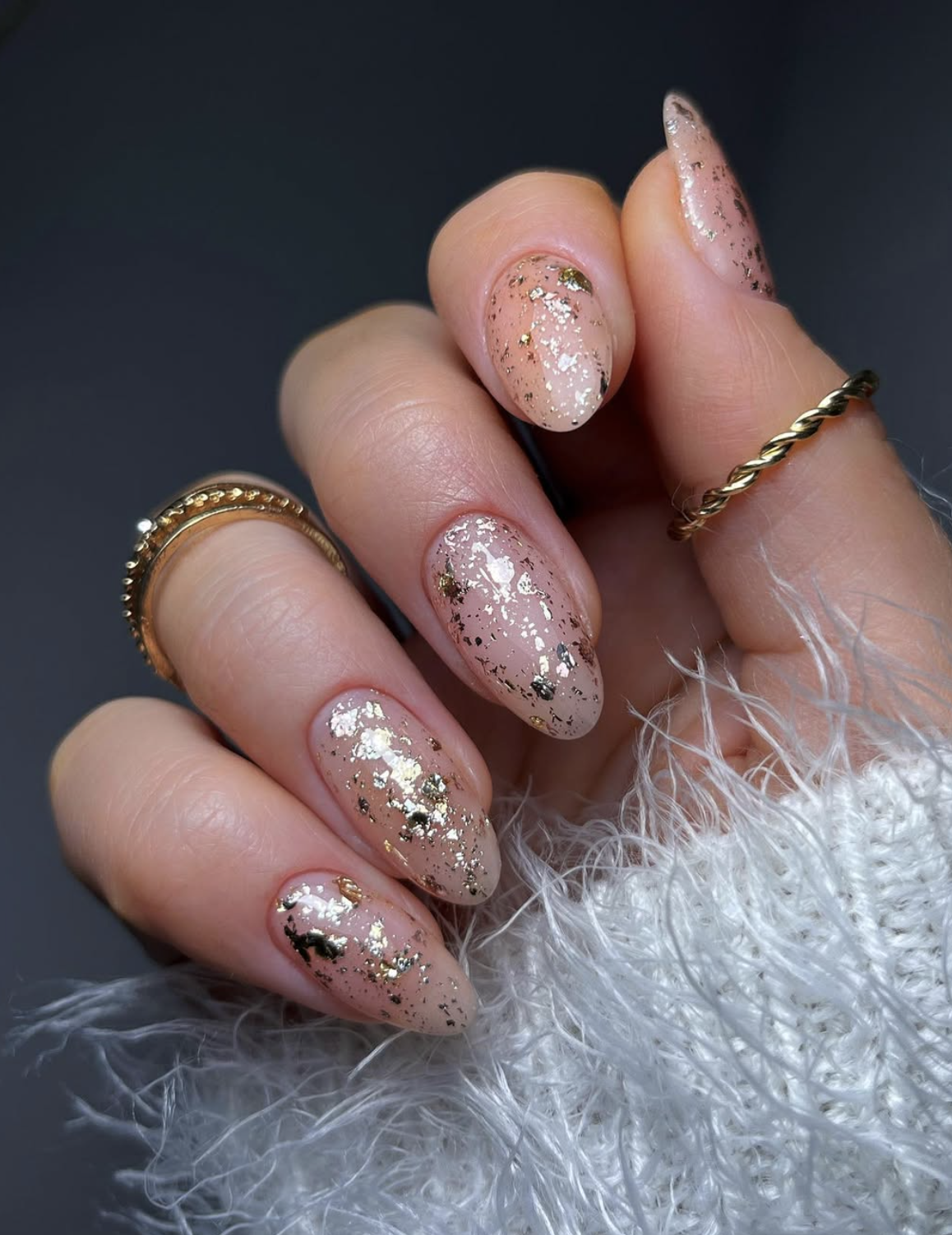 Neutral Thanksgiving nails with delicate gold leaf accents