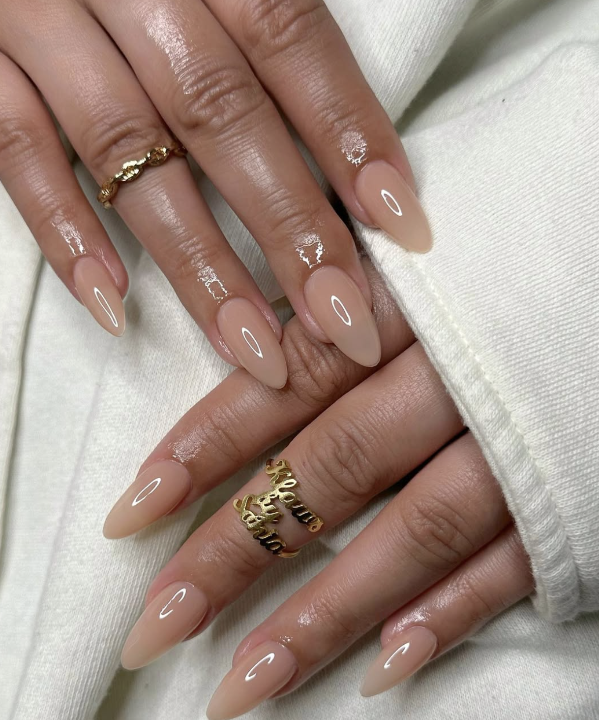 Collage of caramel nude nail designs featuring glossy almond, milky short nails and warm French tips.