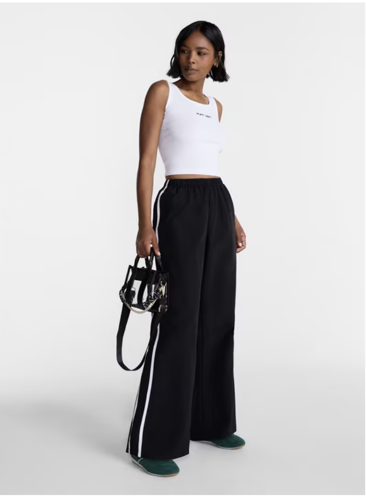 Lightweight nylon track pants designed for a casual streetwear style.