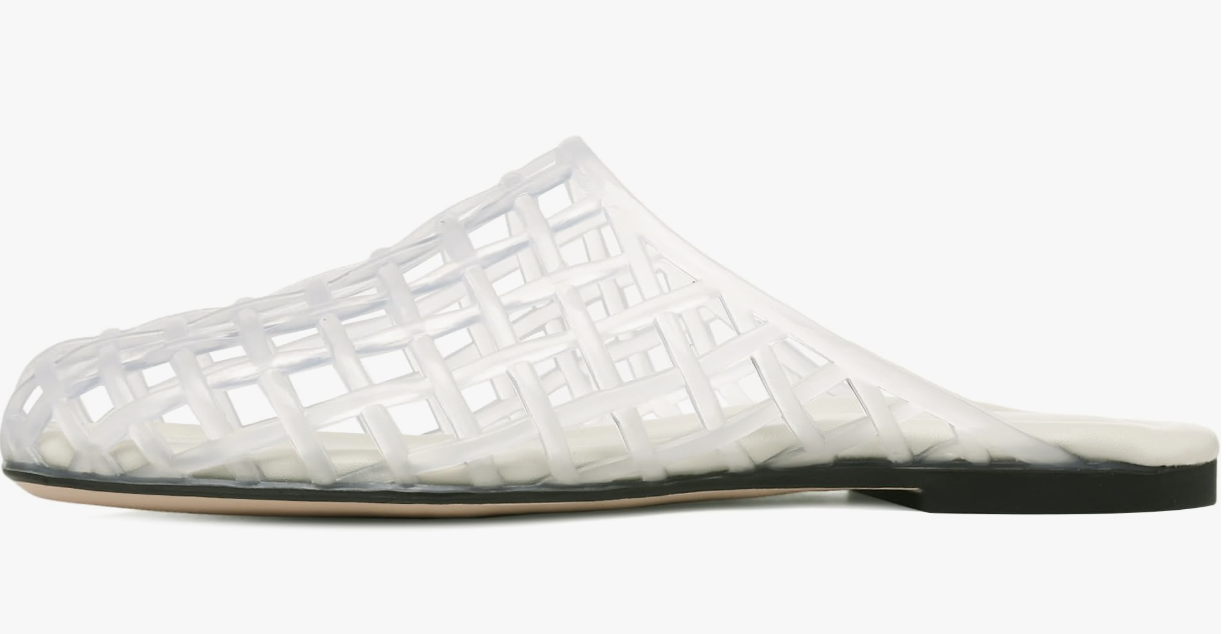 A white mesh jelly slide flat with a woven lattice design and a closed toe on a white background.