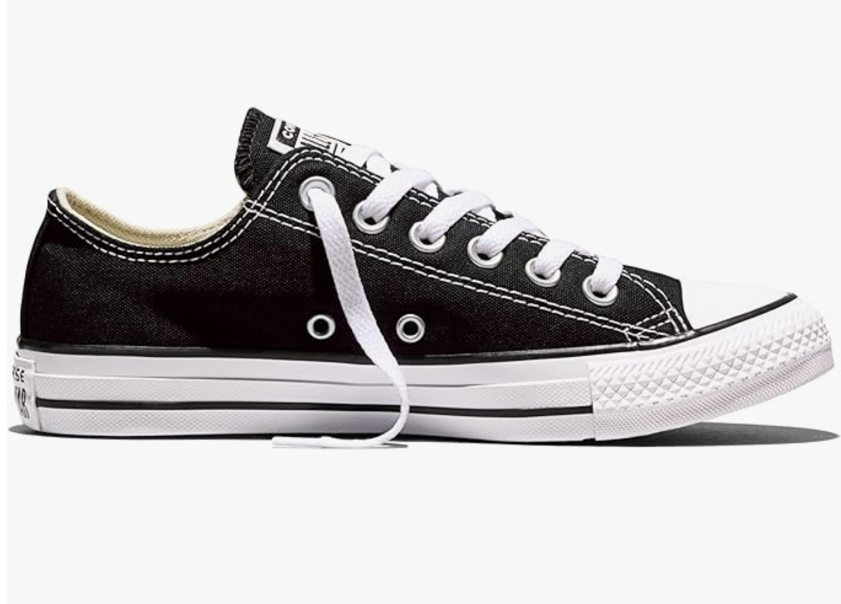Classic black and white Converse Chuck Taylor All Star Low Top sneakers, perfect for creating smart casual work outfits with tailored trousers or suits.