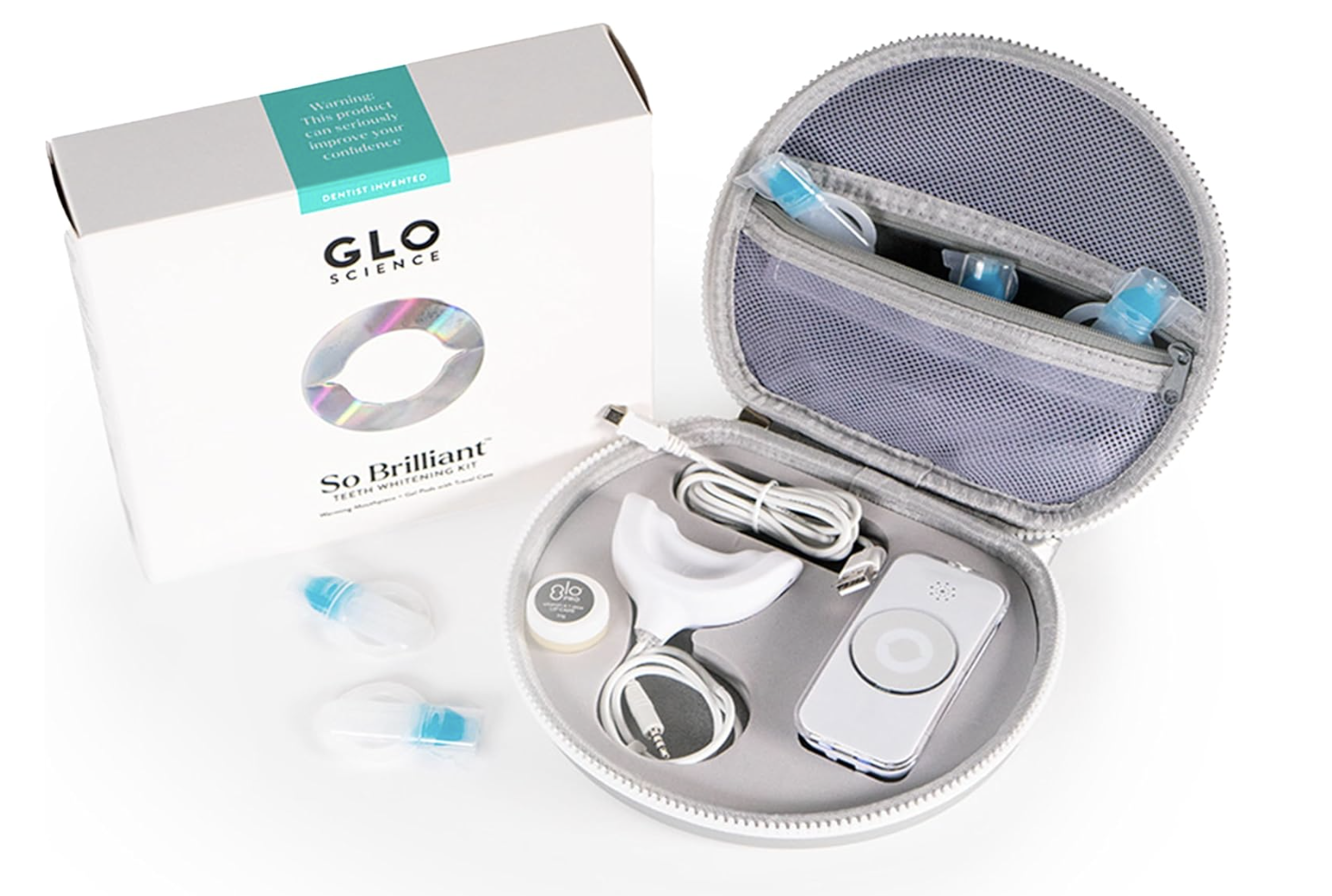GLO Brilliant Teeth Whitening Device kit with the LED light mouthpiece, whitening gel vials, and a gray travel storage case.