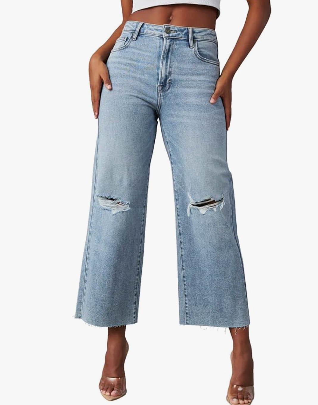 A person wearing high-waisted, light-wash, wide-leg ripped jeans with an ankle-length hem, styled as part of a casual summer BBQ outfit formula.