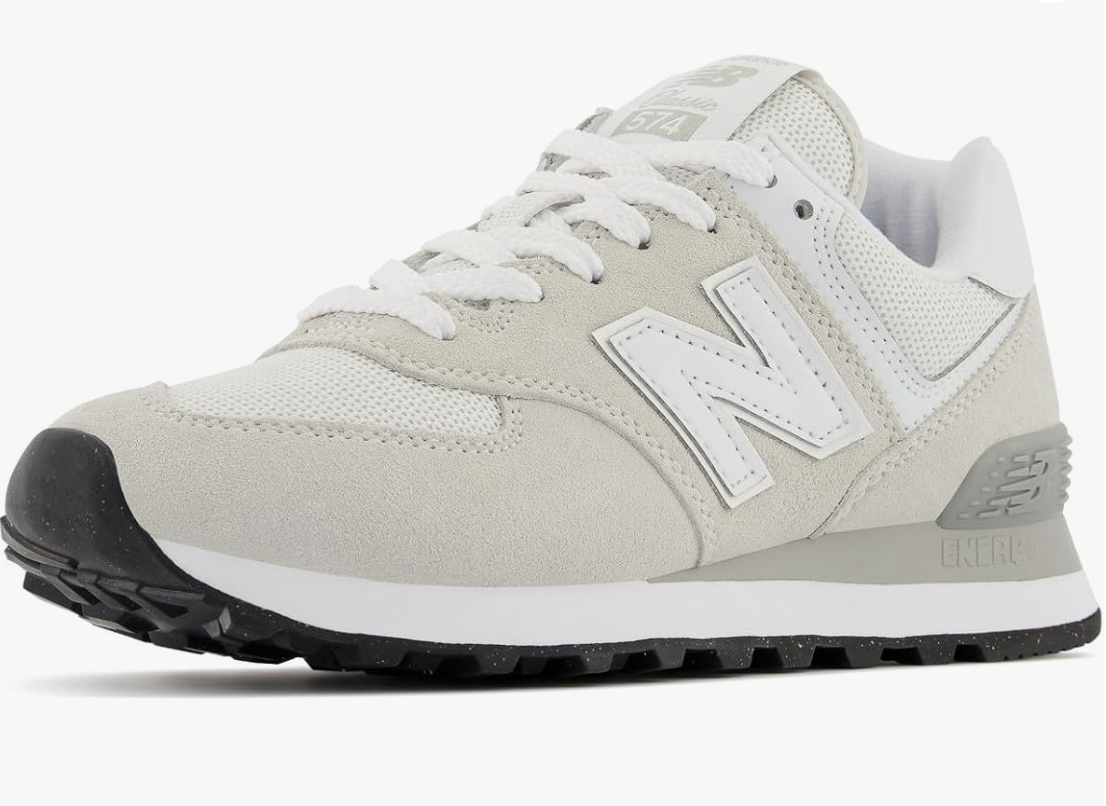 A pair of grey and white New Balance Women's 574 Core Sneakers from Amazon, styled with a bodysuit and baggy pants to create a balanced, sporty look.