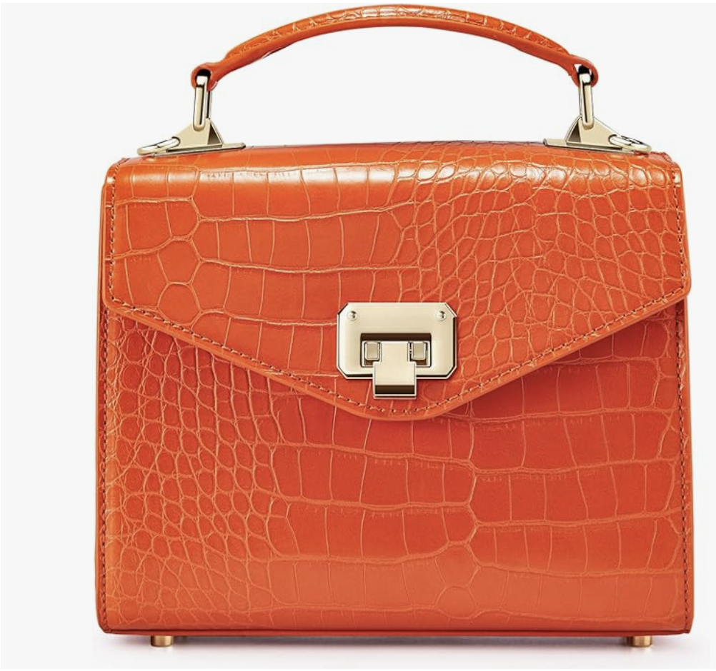 An orange croc-embossed square crossbody bag by Victoria Hyde with a structured top handle and a silver square clasp.