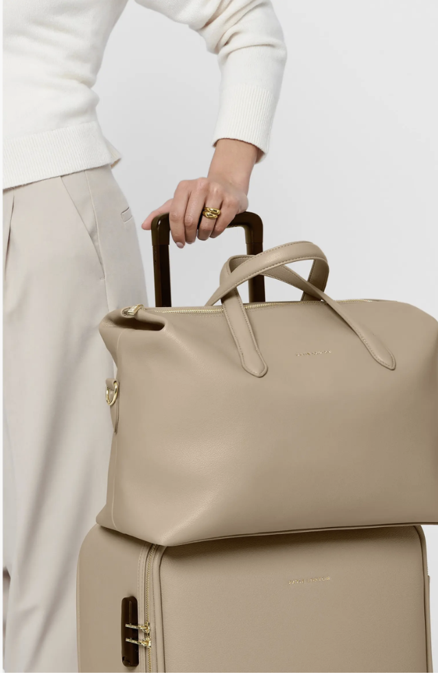 Taupe Katie Loxton Milan Suedette Cabin Bag with fold-down sides and a luggage sleeve.