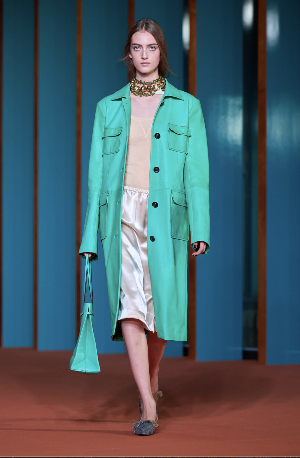 Tory Burch spring 2027 car coat worn over runway separates.