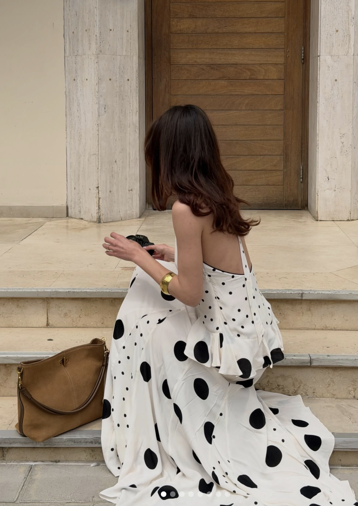 mixed scale polka dot outfit in black and white — small dot top with large dot skirt for an intentional editorial look