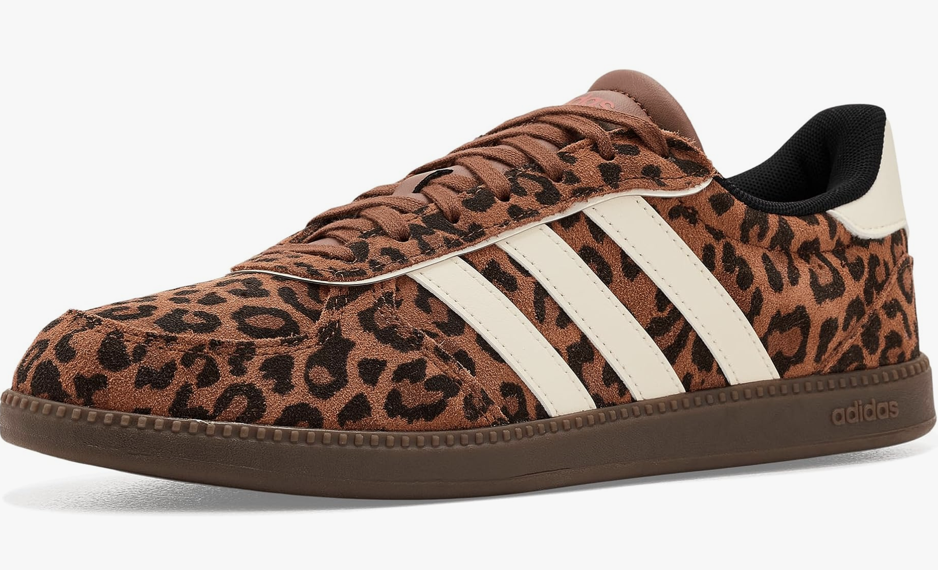 A close-up of an Adidas Breaknet Sleek sneaker in a brown leopard print pattern with white stripes, styled as a statement shoe to wear with white jeans.
