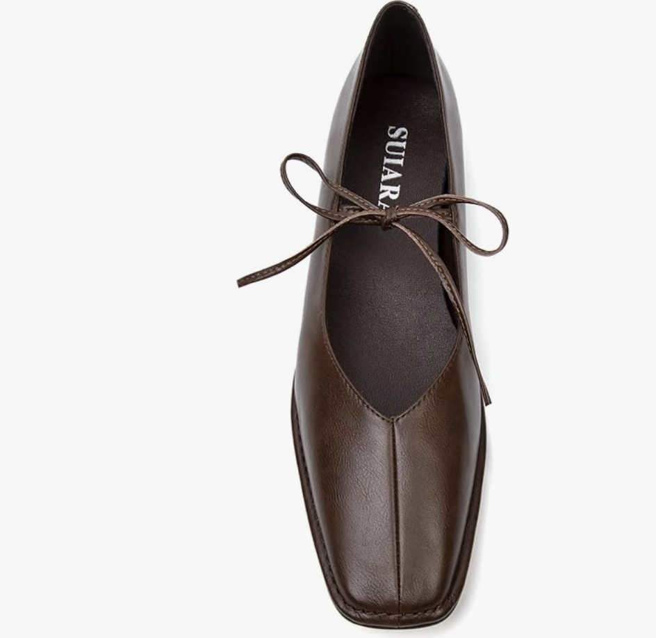 A pair of dark brown leather-look ballet flats with a squared toe and tie-up string detail, styled for a summer outfit idea.