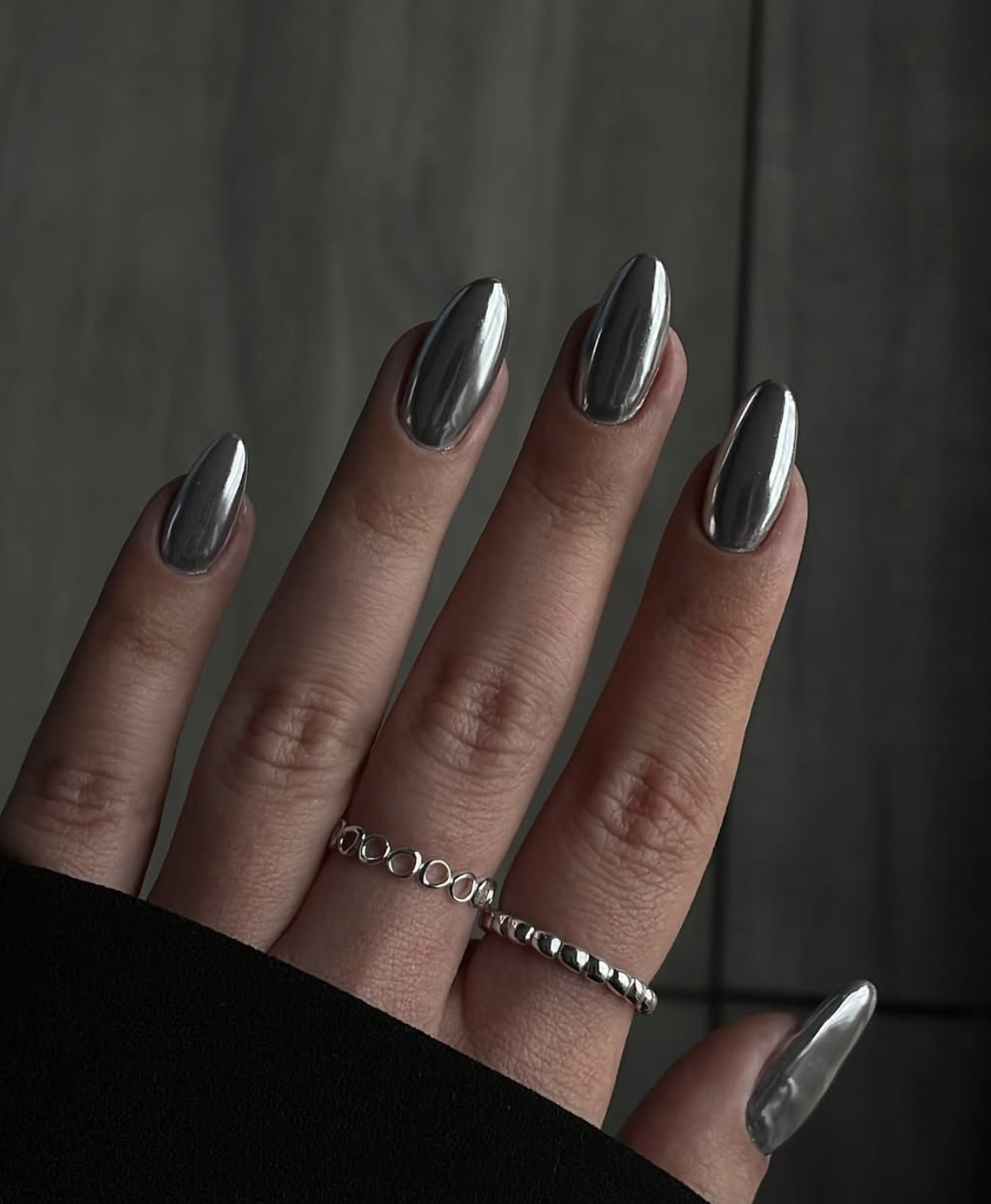 Molten silver chrome October nails with a reflective metallic finish