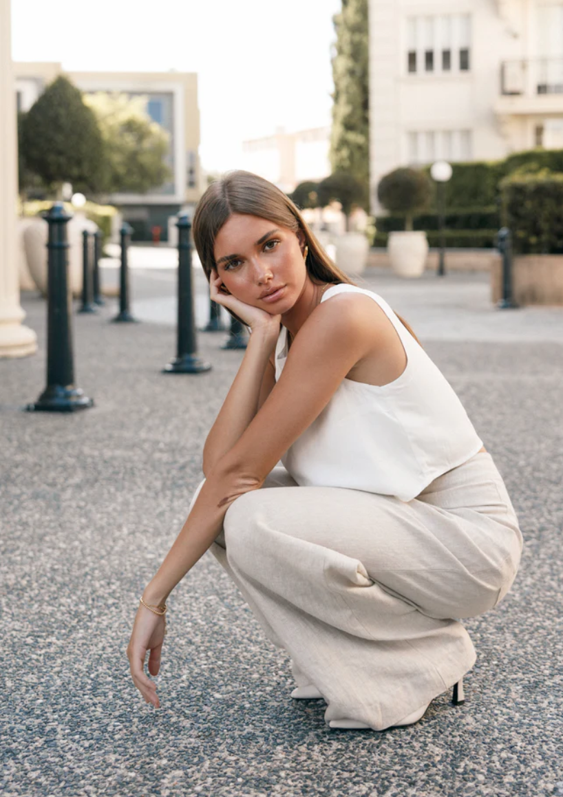 woman posing wearing linen pants