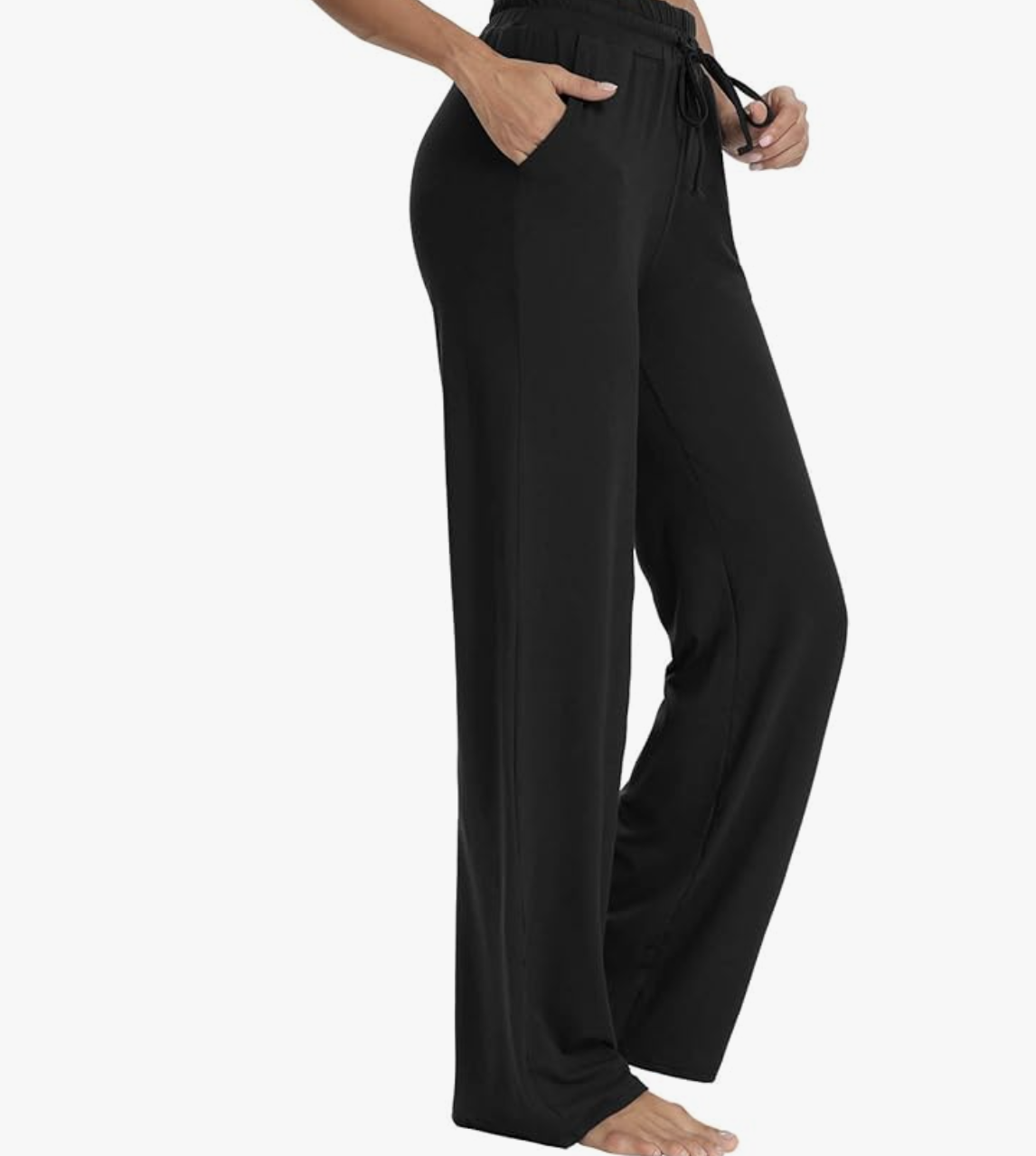 Side view of a woman wearing high-waisted black wide-leg lounge pants with a comfortable drawstring waistband, showcasing a relaxed and breezy silhouette.