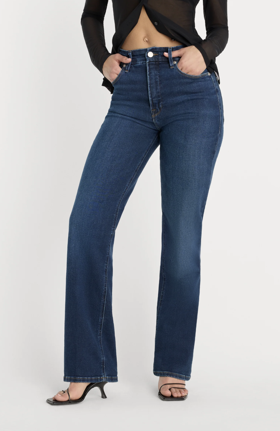 Dark-wash high-waisted straight-leg jeans with pockets.