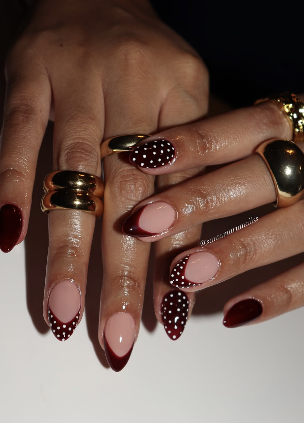 High-gloss cherry red nails on short round nails