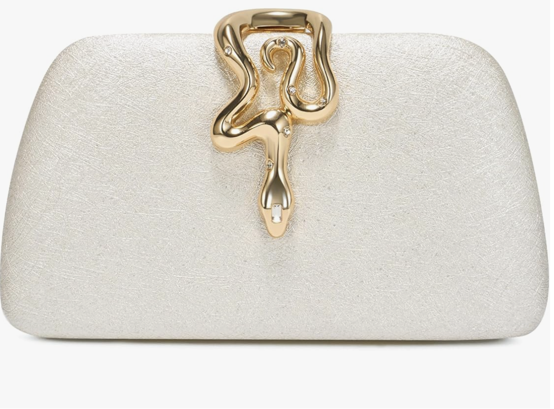 A champagne gold glitter hard-shell clutch bag with a sculptural gold melting-effect clasp, styled as a high-end evening accessory for a resort vacation.