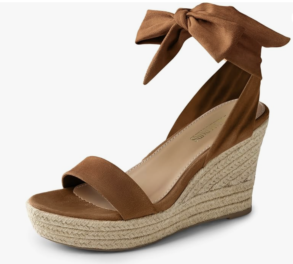 A pair of tan suede-like platform wedge sandals with a woven jute espadrille base and a matching ribbon tie-up ankle strap.