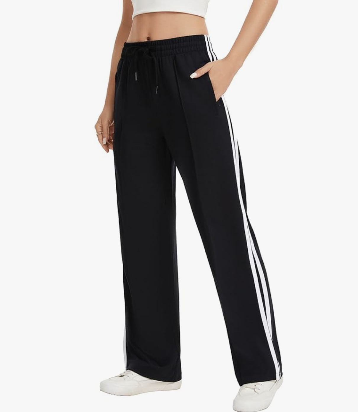 Affordable style hack: Amazon straight-leg track pants in black with white stripes and functional zipper pockets, styled as a polished trouser alternative for a Corporate Sport outfit.