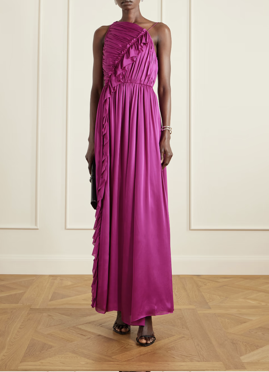 A woman wearing a plum-colored Ulla Johnson Aisha one-shoulder ruffled silk chiffon gown, styled as an elegant investment piece for a luxury spring wedding.