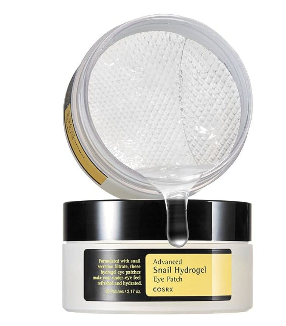 COSRX Advanced Snail Hydrogel Eye Patches in a gold and black jar, featuring 60 patches for hydrating and depuffing the under-eye area.