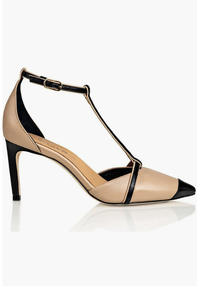 The Joan Oloff Desiree Pump in nude and black leather featuring a sophisticated T-strap design and a slim heel—a refined and comfortable footwear choice for a 2026 professional capsule wardrobe.