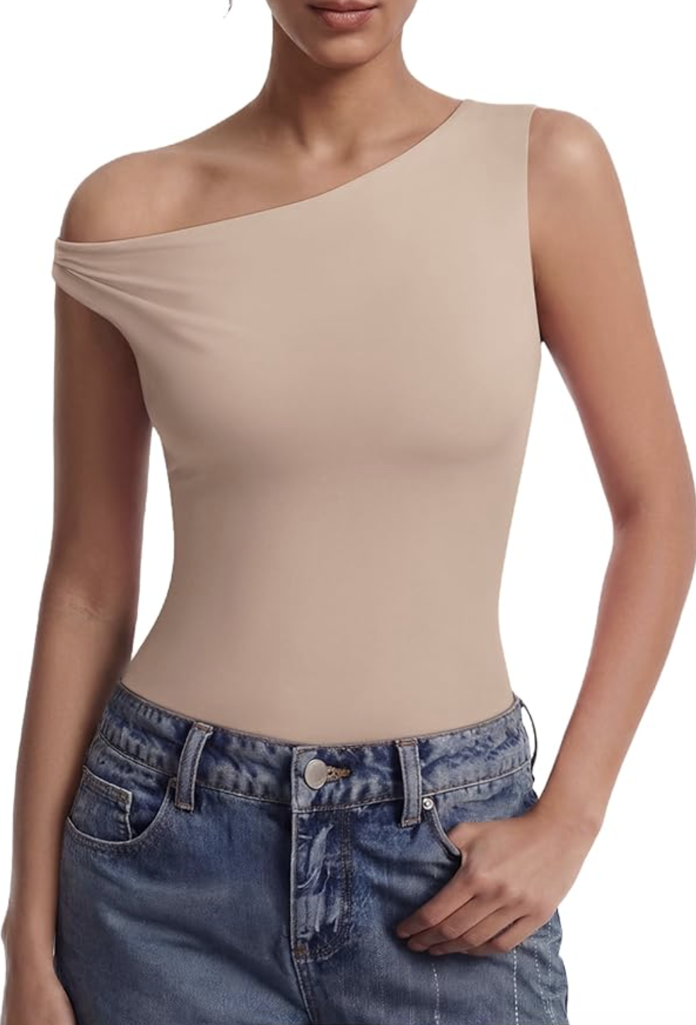 A woman wearing a tan off-the-shoulder thong bodysuit tucked into high-waisted blue straight-leg jeans.