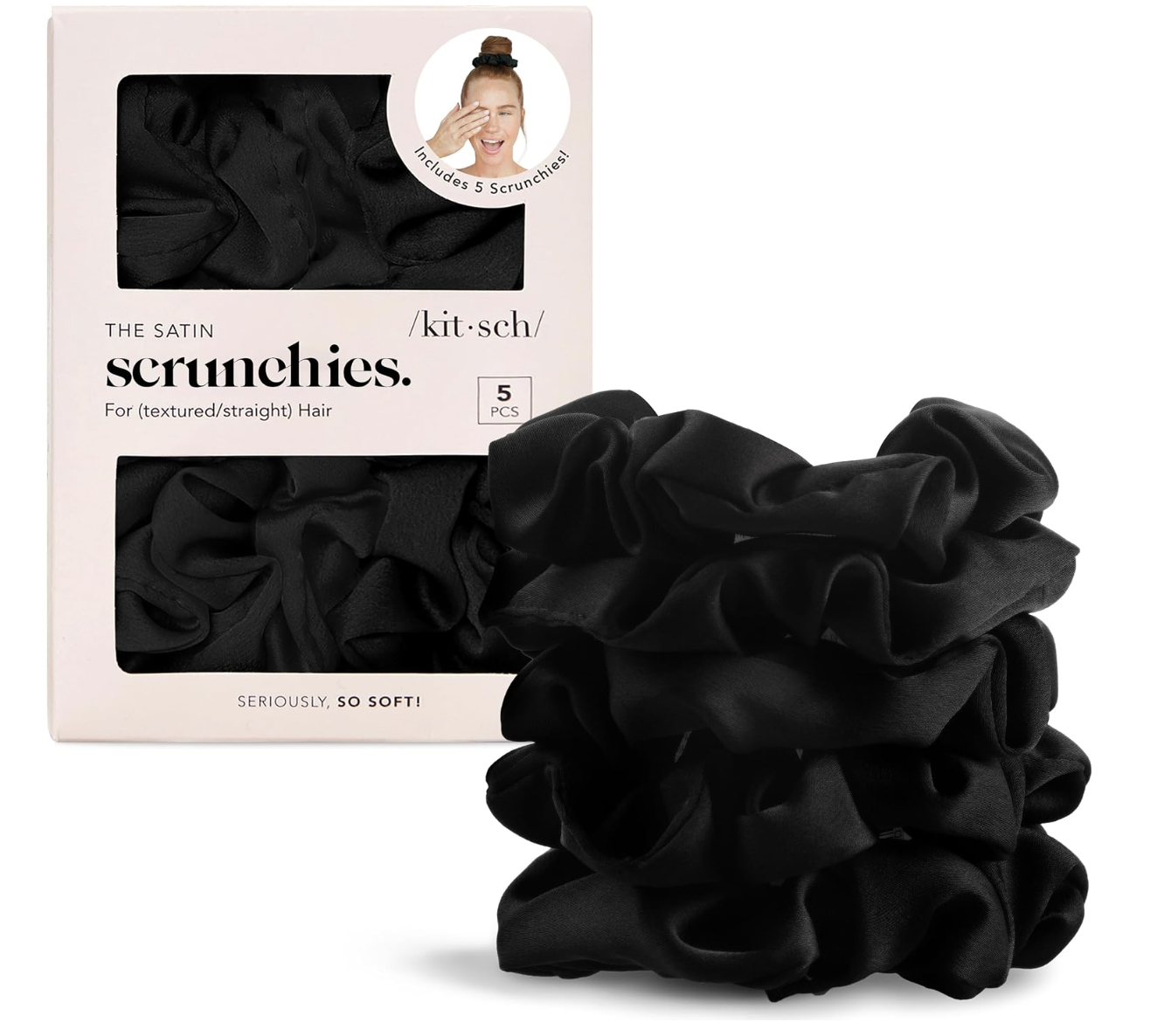 Stack of five black Kitsch satin scrunchies next to their pink box.