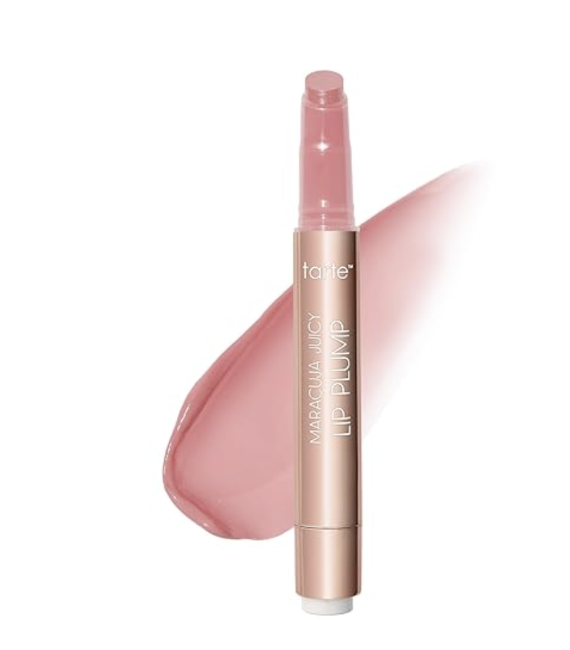 A Tarte Maracuja Juicy Lip Plump click-pen in a soft pink shade with a glossy pink product swatch in the background.