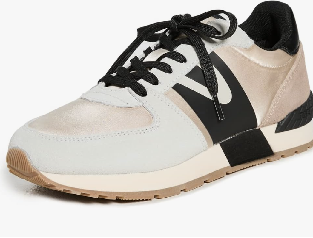 A pair of neutral-toned Tretorn Loyola fashion sneakers, a retro-inspired and professional choice for business-casual work sneakers.