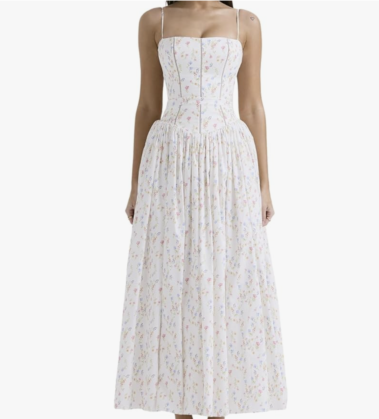 A woman wearing the Lexamen strapless bohemian floral maxi dress in white with a delicate pink and green print, featuring a backless A-line silhouette for a spring 2026 vacation look.