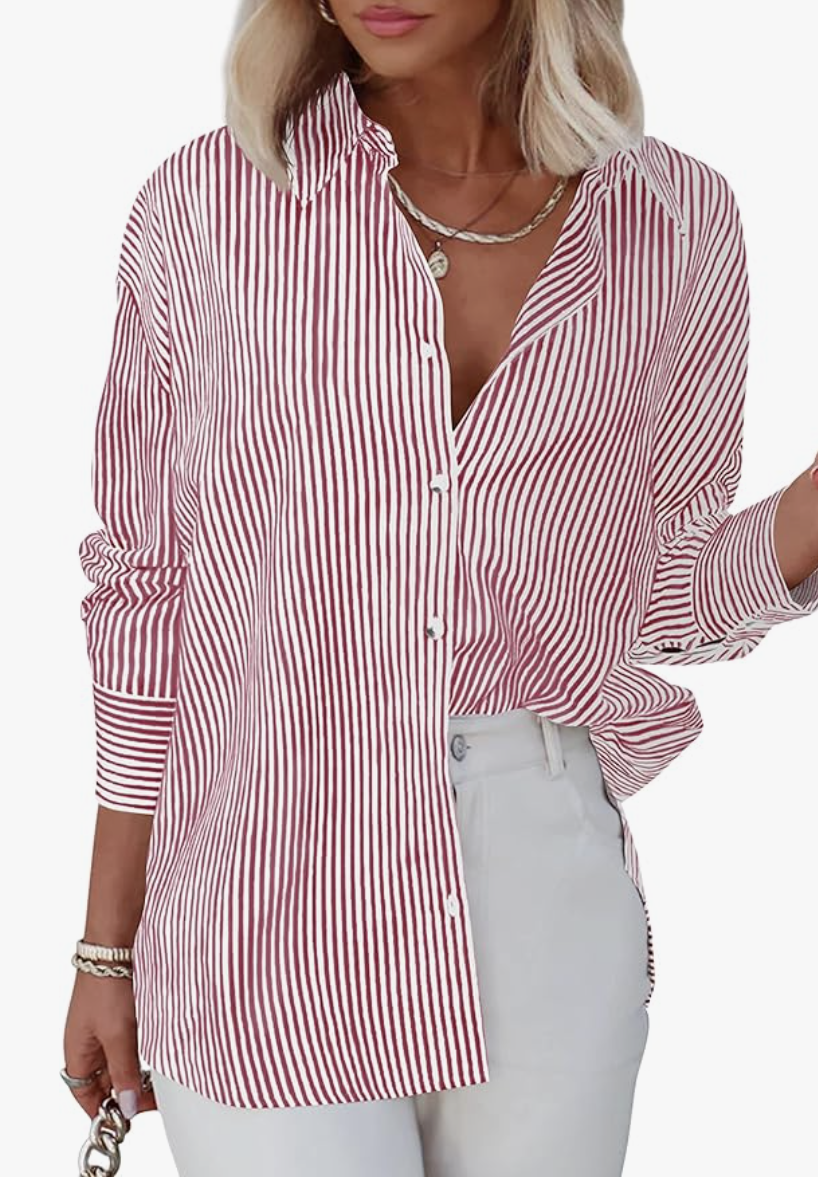 Fashion editor wearing an oversized red and white vertical striped button-down shirt with a front-tuck into white denim, demonstrating a 2026 relaxed outfit formula.
