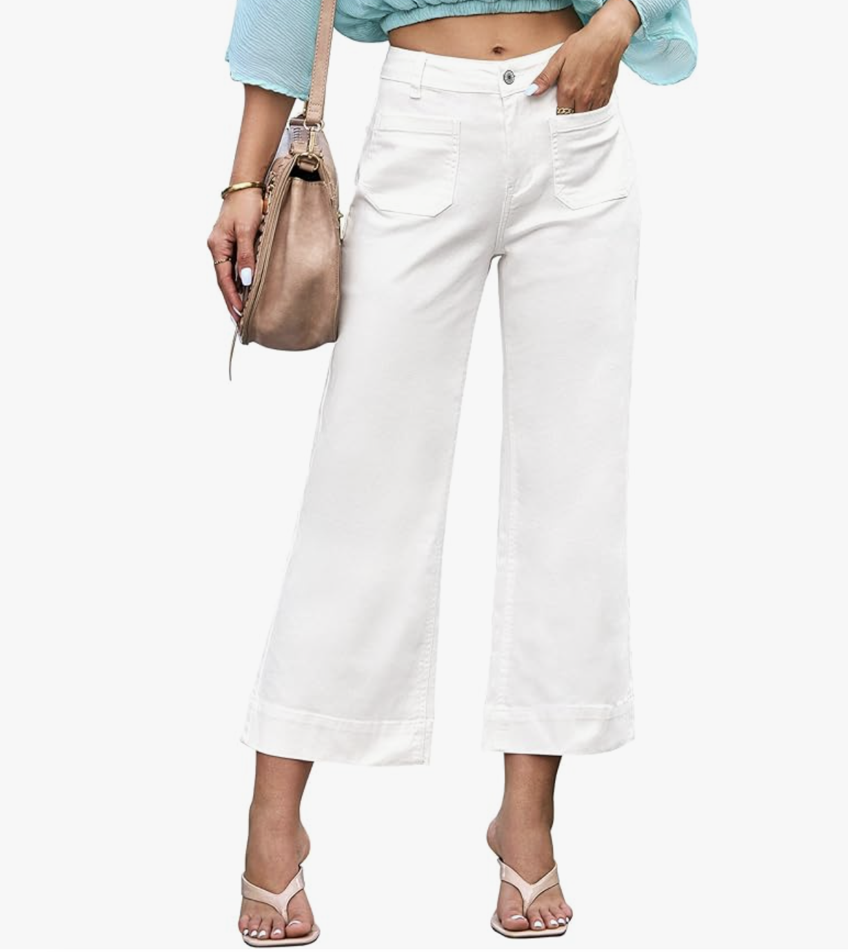 A woman wearing luvamia cream white wide-leg cropped jeans with large front patch pockets and a high-waisted fit, styled with neutral sandals for a 2026 spring outfit.