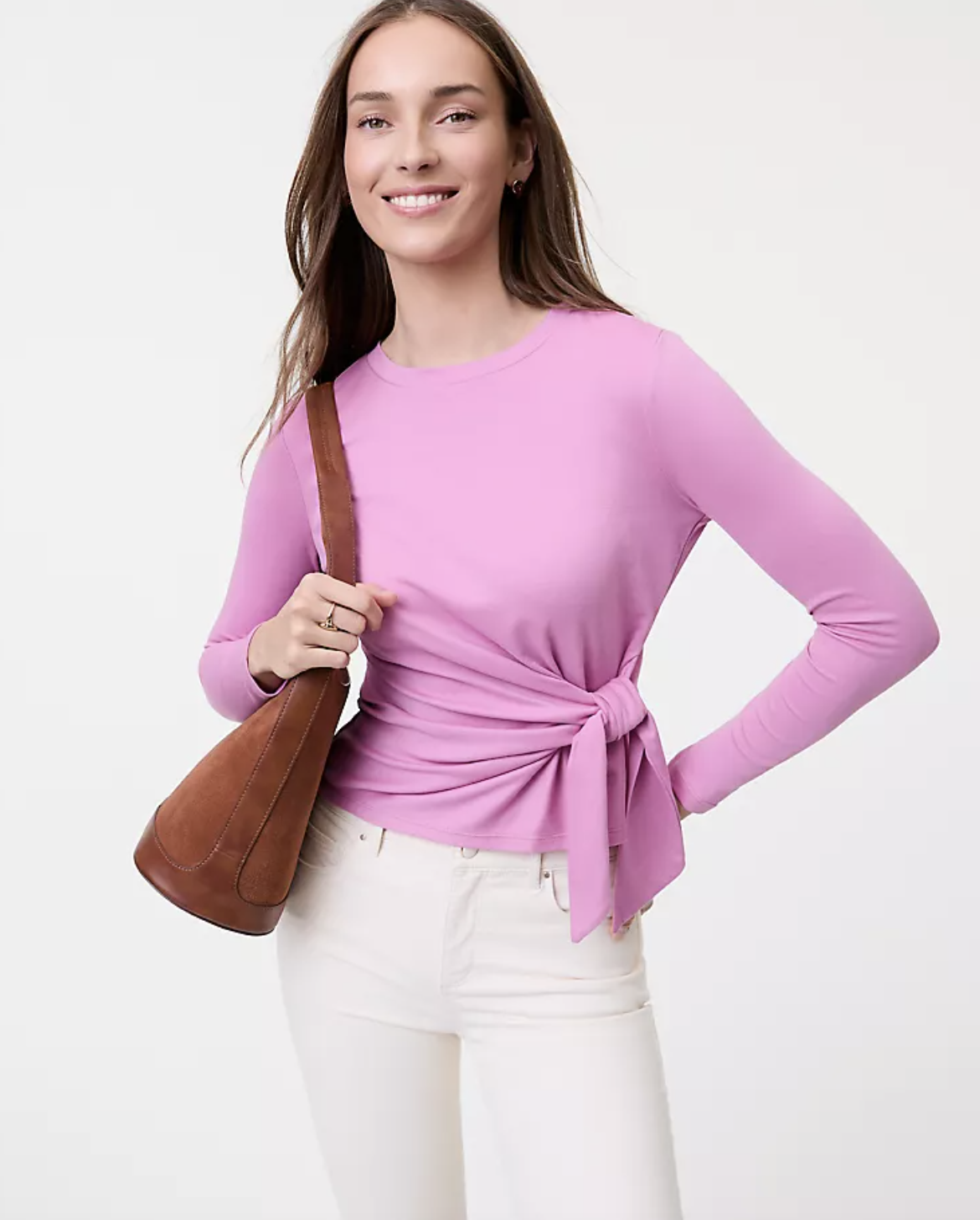 Professional stylist's pick for the Ann Taylor Weekend Collection Tie Waist Top in a vibrant pink knit, featuring a modern asymmetrical side-tie detail and a flattering crew neck.