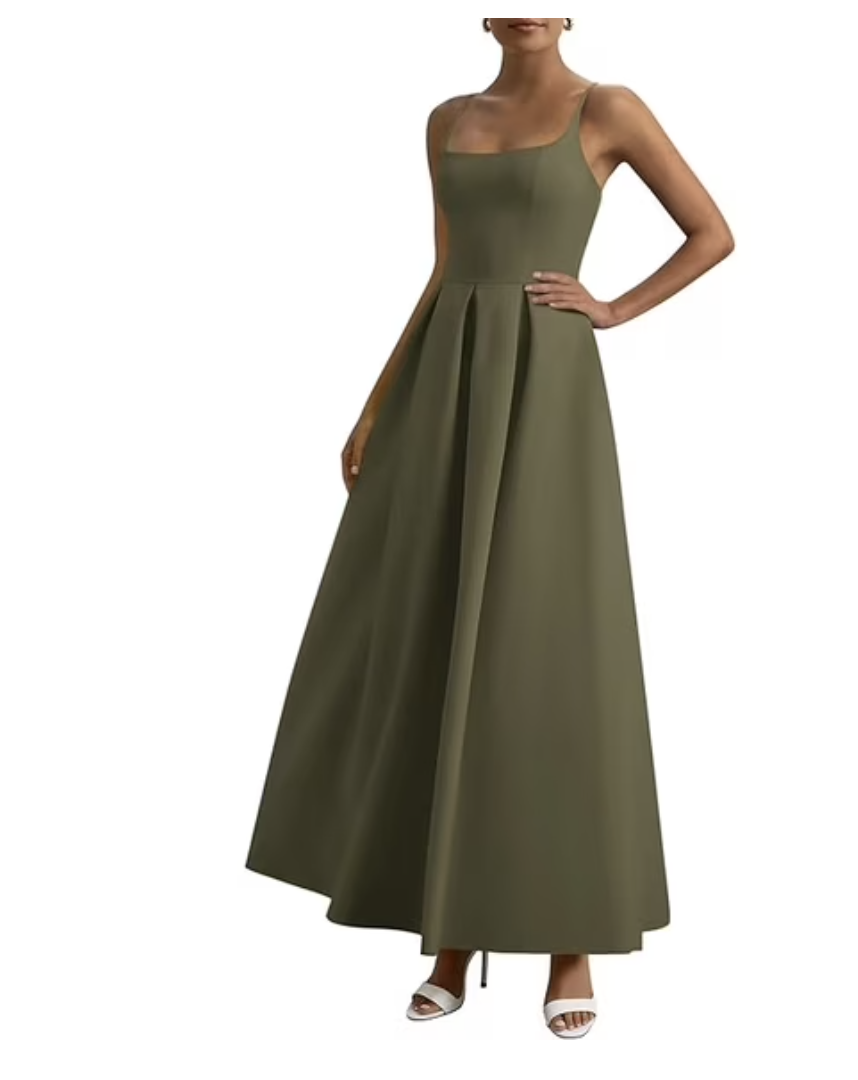 A close-up of a person wearing Free Assembly high-waisted wide-leg jeans in a warm khaki brown tint, featuring large symmetrical front patch pockets and a gold-tone button closure.