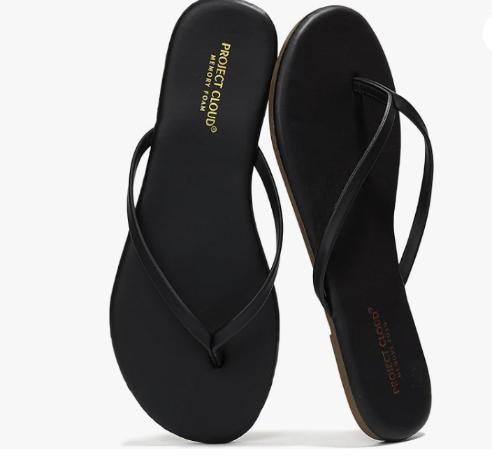 A pair of brown platform wedge thong sandals with a wide whiskey-colored strap and a contoured comfort footbed.