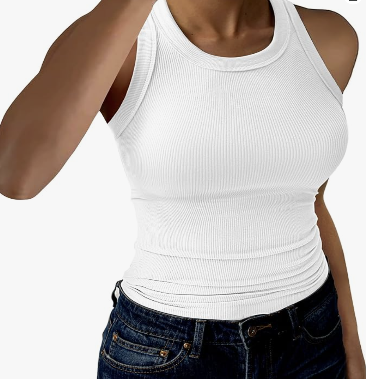 A studio product shot of a woman wearing a white high-neck sleeveless ribbed tank top tucked into blue jeans.