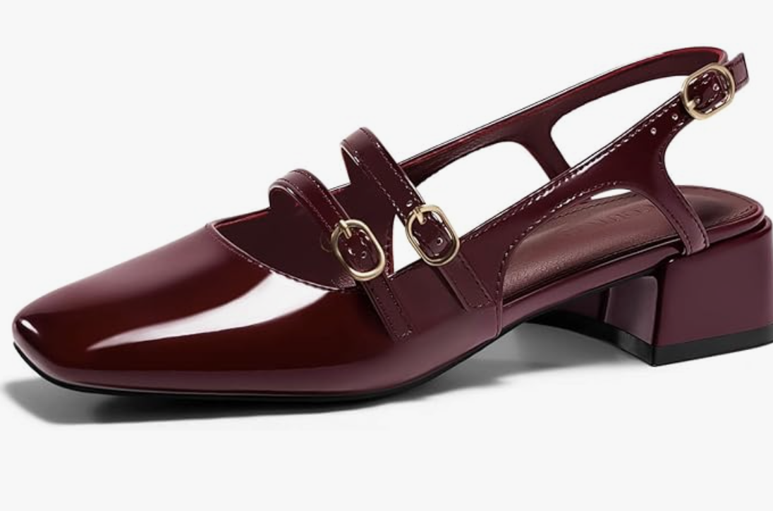 A pair of dark burgundy patent leather Mary Jane flats for women with a square toe, double straps, and gold buckle details.
