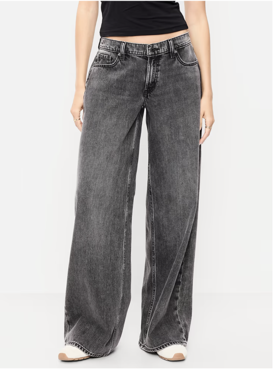 Woman wearing Old Navy 90’s loose jeans in a medium blue wash.