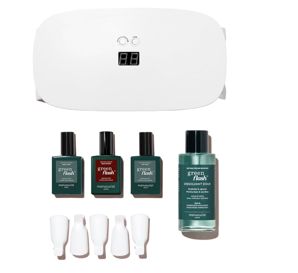 A complete Manucurist Green Flash Essentials Kit featuring the Pro LED lamp, base coat, top coat, red and pink gel colors, and acetone-free remover.