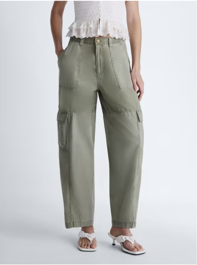 Modern cargo barrel pants showing a curved leg silhouette and utility details.