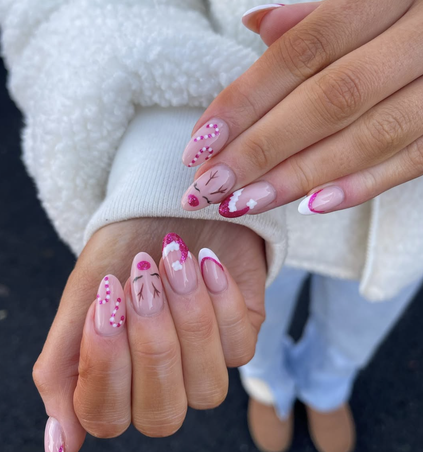Short glossy red Christmas nails with candy cane stripe accent nails