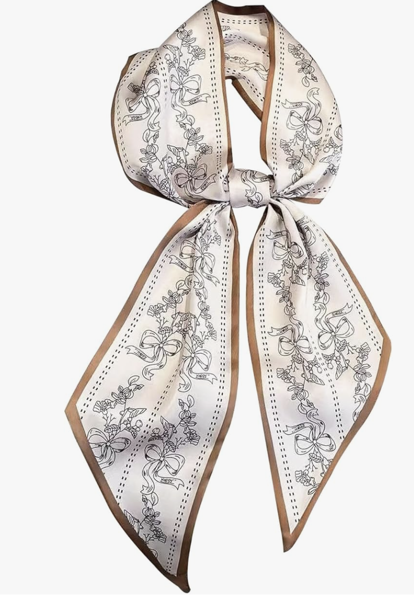 Woman wearing a Hioyiwse long thin satin headscarf in a beige botanical print, styled as a chic neck accessory for women over 60.