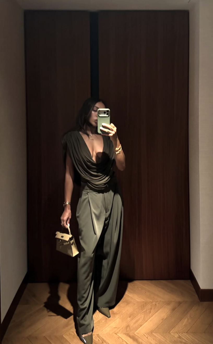 A summer-ready green linen pants outfit with a silk camisole and sandals.