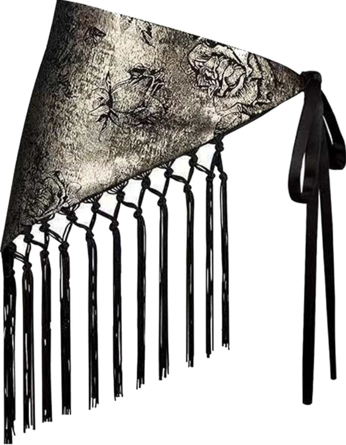 A close-up of a black and white floral skinny scarf with long black tassels being used as a belt over a white structured blazer and matching shorts.