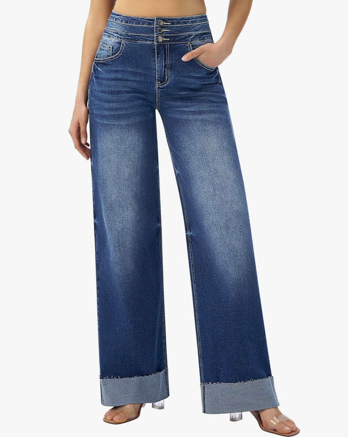 A close-up view of the Cuffed Baggy Jeans in a medium wash, showing the wide-leg silhouette and thick rolled cuffs styled with open-toe sandals.