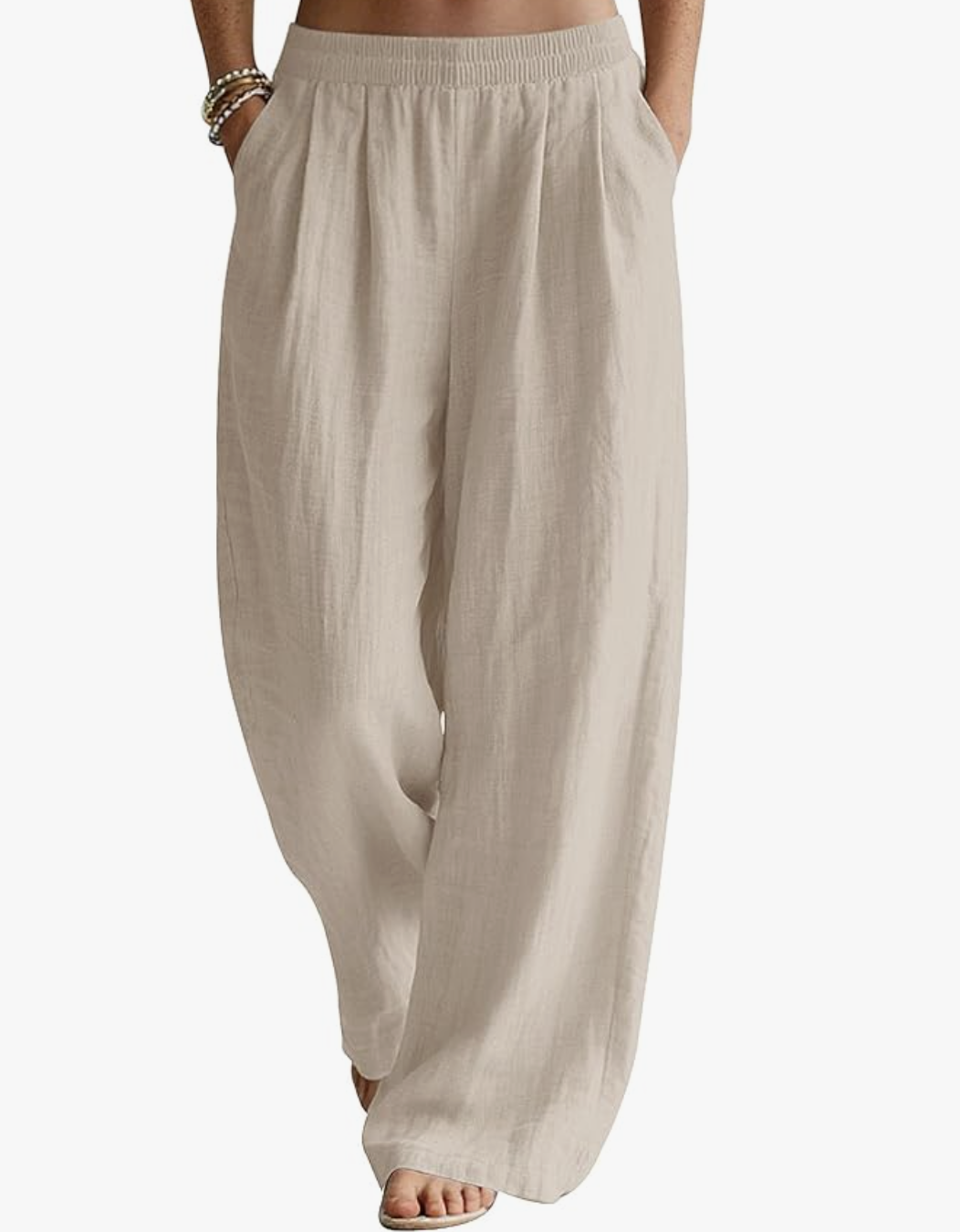 A close-up of a person wearing high-waisted, wide-leg LOMON trousers in a khaki linen fabric, featuring a comfortable elastic waistband and side pockets.